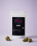 24K CBD Flower front view, white resealable bag on a pale lilac studio background