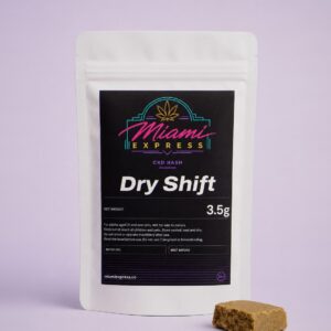 Dry Shift CBD Hash front view, white resealable bag on a pale lilac studio background