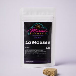 La Mousse CBD Hash front view, white resealable bag on a pale lilac studio background