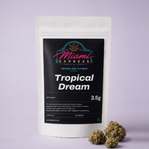 Tropical Dream CBD Flower front view, white resealable bag on a pale lilac studio background